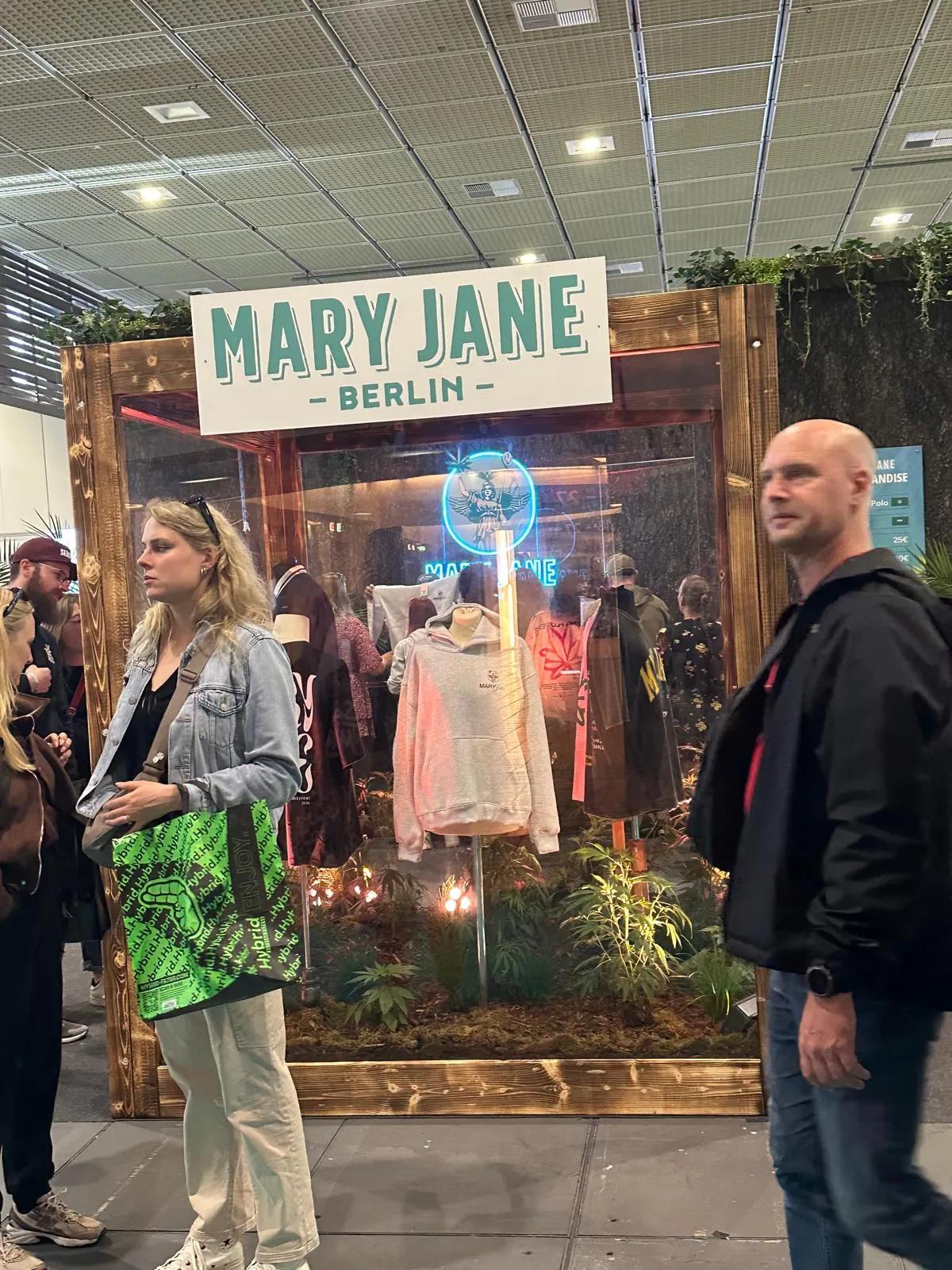 Mary Jane Berlin official merchandise display with a neon sign at Mary Jane Berlin 2026